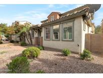 Charming home featuring well-maintained landscaping with beautiful windows and a beige exterior at 7336 S 48Th Gln, Laveen, AZ 85339