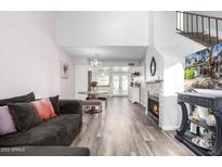 Bright and airy living space offering an open layout, fireplace, and stylish decor at 860 N Mcqueen Rd # 1213, Chandler, AZ 85225
