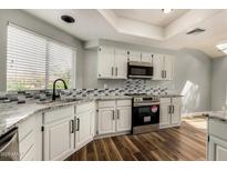 Updated kitchen with granite countertops and stainless steel appliances at 3832 N Gallatin --, Mesa, AZ 85215