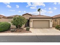 Charming single-story home with tile roof, desert landscaping, and a two-car garage at 4517 E Sourwood Dr, Gilbert, AZ 85298