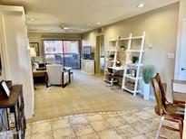 Inviting living room with a balcony, offering a cozy seating area and a stylish workspace at 12222 N Paradise Village Pkwy # 321, Phoenix, AZ 85032