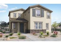 Charming two-story home with neutral stucco, stone accents, covered entry, and manicured front yard at 14594 W Sand Hills Rd, Surprise, AZ 85387