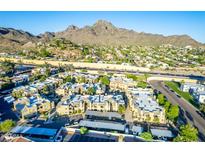 Panoramic aerial view of community with mountain backdrop and lush green landscape at 1880 E Morten Ave # 242, Phoenix, AZ 85020