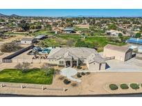 Expansive property featuring a well-manicured lawn, pool, guest house and spacious single-Gathering home at 19535 E Via De Olivos Rd, Queen Creek, AZ 85142