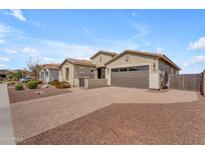 Charming single-story home with desert landscaping and a brick-paved driveway leading to the garage at 20340 E Camacho Rd, Queen Creek, AZ 85142