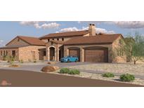 Expansive stone-accented home featuring a front-facing two-car garage and a light blue vehicle parked in the driveway at 21235Xxx W Elliot Rd, Buckeye, AZ 85326