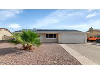 Charming single-story home with desert landscaping and a two-car garage at 2262 E Javelina Ave, Mesa, AZ 85204