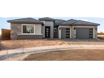 A charming single-Gathering home with a two-car garage and tasteful accents at 27046 W Rockwood Dr, Buckeye, AZ 85396