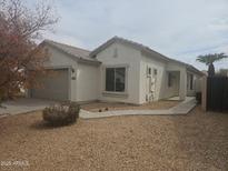 A single story exterior features a low maintenance desert style landscape at 2729 E Carol Ave, Mesa, AZ 85204