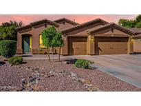 Inviting front exterior showcases a desert landscape and charming accents, perfect for a warm welcome at 3662 E Megan St, Gilbert, AZ 85295