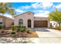 Charming single-story home featuring a two-car garage, neutral stucco exterior, and well-manicured landscaping at 9229 W Willow Bend Ln, Phoenix, AZ 85037