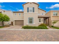 Charming two-story home with neutral stucco, a brown garage door, and inviting curb appeal at 17160 N 9Th Pl, Phoenix, AZ 85022