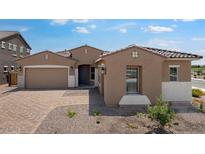 Charming single-story home with a two-car garage, complemented by a well-maintained yard and inviting curb appeal at 17841 W Windsor Blvd, Litchfield Park, AZ 85340