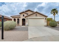Charming single-story home with desert landscaping and a two-car garage in a quiet neighborhood at 1979 N Vista Ln, Casa Grande, AZ 85122