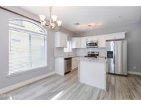 Modern kitchen with stainless steel appliances, granite countertops, and ample cabinet space at 2725 E Mine Creek Rd # 1031, Phoenix, AZ 85024