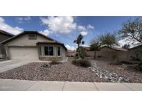 Charming single-story home with desert landscaping and a cozy bay window at 41580 W Sunland Dr, Maricopa, AZ 85138