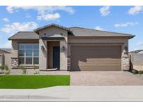 Charming single-Gathering home featuring a well-manicured lawn and a welcoming two-car garage at 5619 N 193Rd Ave, Litchfield Park, AZ 85340