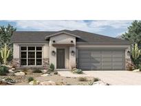 Charming single-story home with a two-car garage and desert landscaping at 5619 N 193Rd Ave, Litchfield Park, AZ 85340