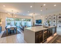 Stylish kitchen island overlooking dining and living areas with stainless steel appliances and sleek countertops at 7330 E Vista Bonita Dr, Scottsdale, AZ 85255