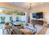 Cozy living area with large windows, comfortable seating, and a serene view of the outdoor space at 7330 E Vista Bonita Dr, Scottsdale, AZ 85255