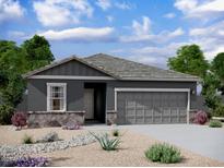 Charming single-story home features stone accents, a neutral color palette, and a two-car garage at 13240 E Verbina Ln, Florence, AZ 85132