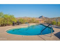 Beautiful pool with mountain views and comfortable seating area perfect for relaxation and outdoor enjoyment at 16336 E Ridgeline Dr, Fountain Hills, AZ 85268