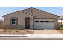 A charming single-story home with a two-car garage, neutral stucco exterior, and low-maintenance desert landscaping at 24493 W Grenadine Rd, Buckeye, AZ 85326