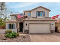 Charming two-story home with a manicured lawn and attached two-car garage at 2605 W Golden Puma Trl, Phoenix, AZ 85085