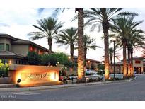 The Santana Ridge condominium complex entrance features lighted signage, mature landscaping, and access to the community at 3330 S Gilbert Rd # 1003, Chandler, AZ 85286