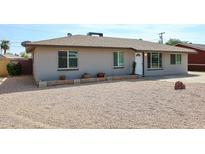 Charming single-story home with a well-maintained desert landscape front yard and neutral exterior at 811 E Seldon Ln, Phoenix, AZ 85020