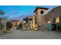 Stunning desert landscape design highlighting mature cacti, desert vegetation, and beautiful stone path at 11457 E Salero Dr, Scottsdale, AZ 85262
