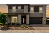 Beautiful two-story home with modern design, manicured landscaping, and a two-car garage at 4746 S Orbit St, Mesa, AZ 85212