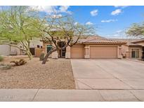 Charming single story home with a three car garage and desert landscaping at 10603 E Firewheel Dr, Scottsdale, AZ 85255