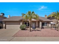 Charming single-story home featuring desert landscaping and a two-car garage at 4110 W Villa Linda Dr, Glendale, AZ 85310