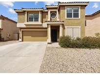Two-story home with a well-maintained front yard and neutral-colored exterior at 540 W Palo Verde St, Casa Grande, AZ 85122