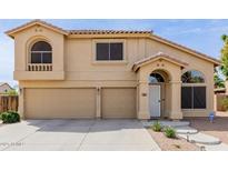Charming two-story home with a three-car garage and well-manicured landscaping at 565 E Rosebud Dr, San Tan Valley, AZ 85143