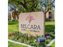 Belcara at McCormick Ranch sign surrounded by flower beds and trees at 8260 E Arabian Trl # 275, Scottsdale, AZ 85258