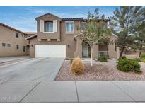 Charming two-story home with a two-car garage and a well-maintained front yard at 9364 W Cordes Rd, Tolleson, AZ 85353
