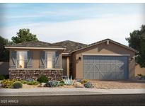 Charming single-story home with stone accents, a two-car garage, and a well-manicured front yard at 159 N 175Th Ave, Goodyear, AZ 85338