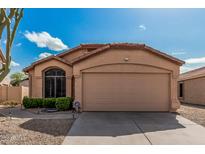 Charming single-story home featuring a two-car garage and well-maintained landscaping at 21819 N 48Th St, Phoenix, AZ 85054