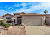 Charming single-story home featuring a well-maintained front yard and a two-car garage at 3907 E Topeka Dr, Phoenix, AZ 85050