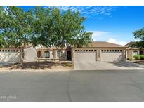 Charming single-story home with three-car garage and beautifully landscaped front yard at 10960 E Monte Ave # 169, Mesa, AZ 85209