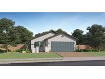 Charming single-story home with a two-car garage, desert landscaping, and a welcoming entryway at 23225 W Marguerite Ave, Buckeye, AZ 85326