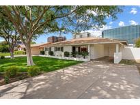 Charming single-story home with a well-manicured lawn and inviting curb appeal at 2436 E Elm St, Phoenix, AZ 85016