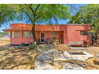 Quaint one story home boasts mature landscaping with a stone walkway and front porch at 330 W Minnezona Ave, Phoenix, AZ 85013