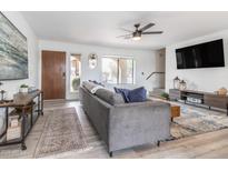 Inviting living room features stylish decor, modern ceiling fan, and neutral paint tones at 16336 E Palisades Blvd # 7, Fountain Hills, AZ 85268