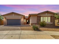 Charming single-story home with stone accents, desert landscaping, and a welcoming front entrance at 22434 S 226Th Pl, Queen Creek, AZ 85142