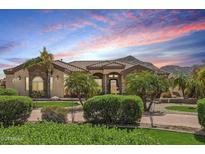 Beautifully landscaped single-story home with a tiled roof and mountain views at 5523 W Creekside Ln, San Tan Valley, AZ 85144