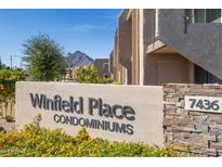 Winfield Place Condominiums community signage and address, with desert landscaping and mountain view at 7436 E Chaparral Rd # 159B, Scottsdale, AZ 85250
