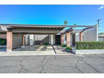Inviting home exterior with covered parking and desert landscaping at 1216 E Ormondo Way, Phoenix, AZ 85014